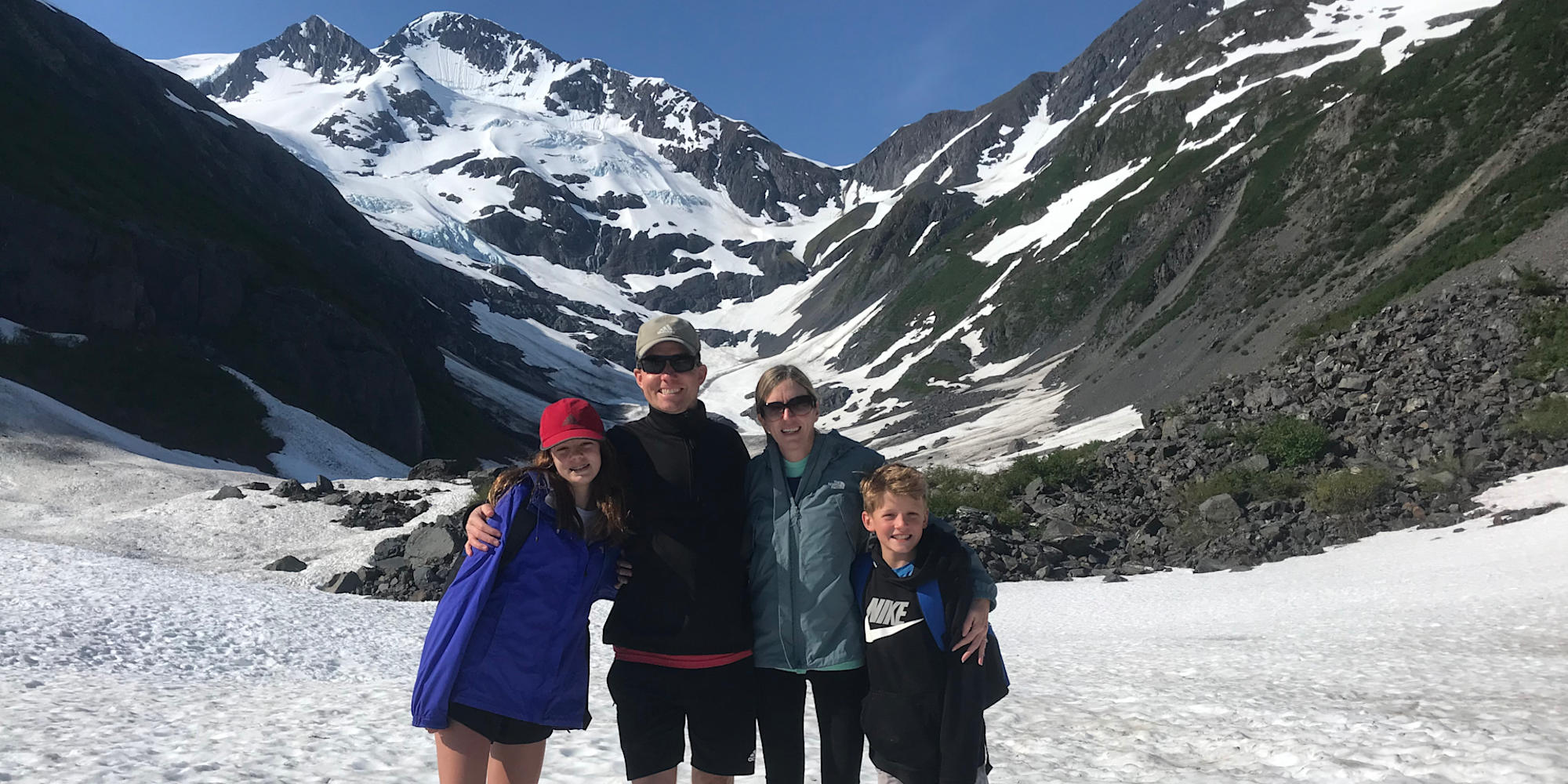 Family enjoying their time on a glacier hike in Alaska